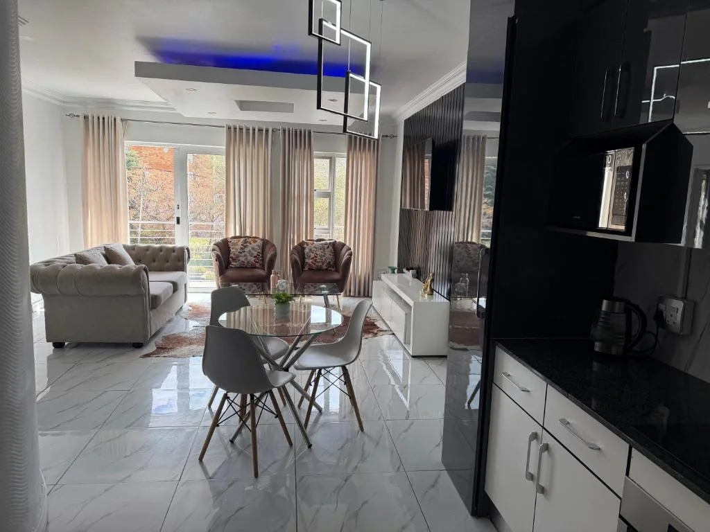 Private kitchen and open-plan dining area in the apartment