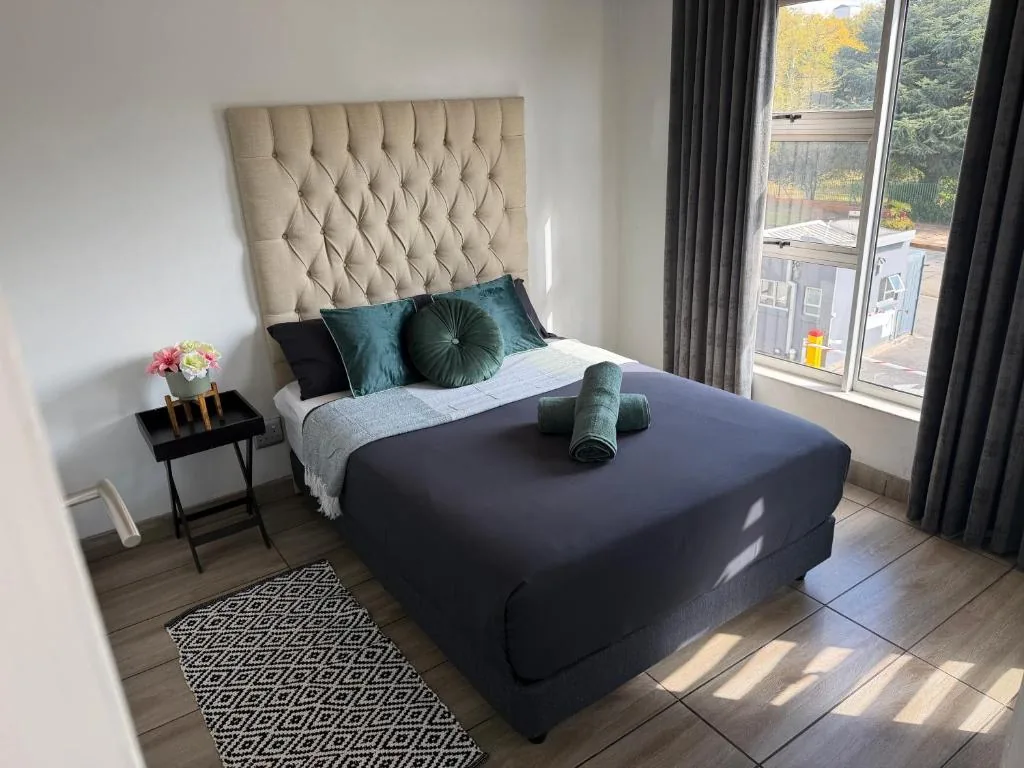 Two-Bedroom Apartment bedroom with a full bed